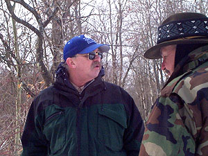 Basha Kill Association board member and interpretive guide Gary Keeton explains the terrain to a hiker during a winter wetland walk.